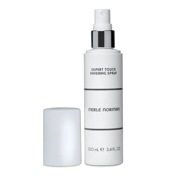 Merle Norman Expert Touch Finishing Spray bottle on a white background.