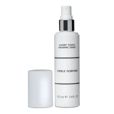 Merle Norman Expert Touch Finishing Spray bottle on a white background.