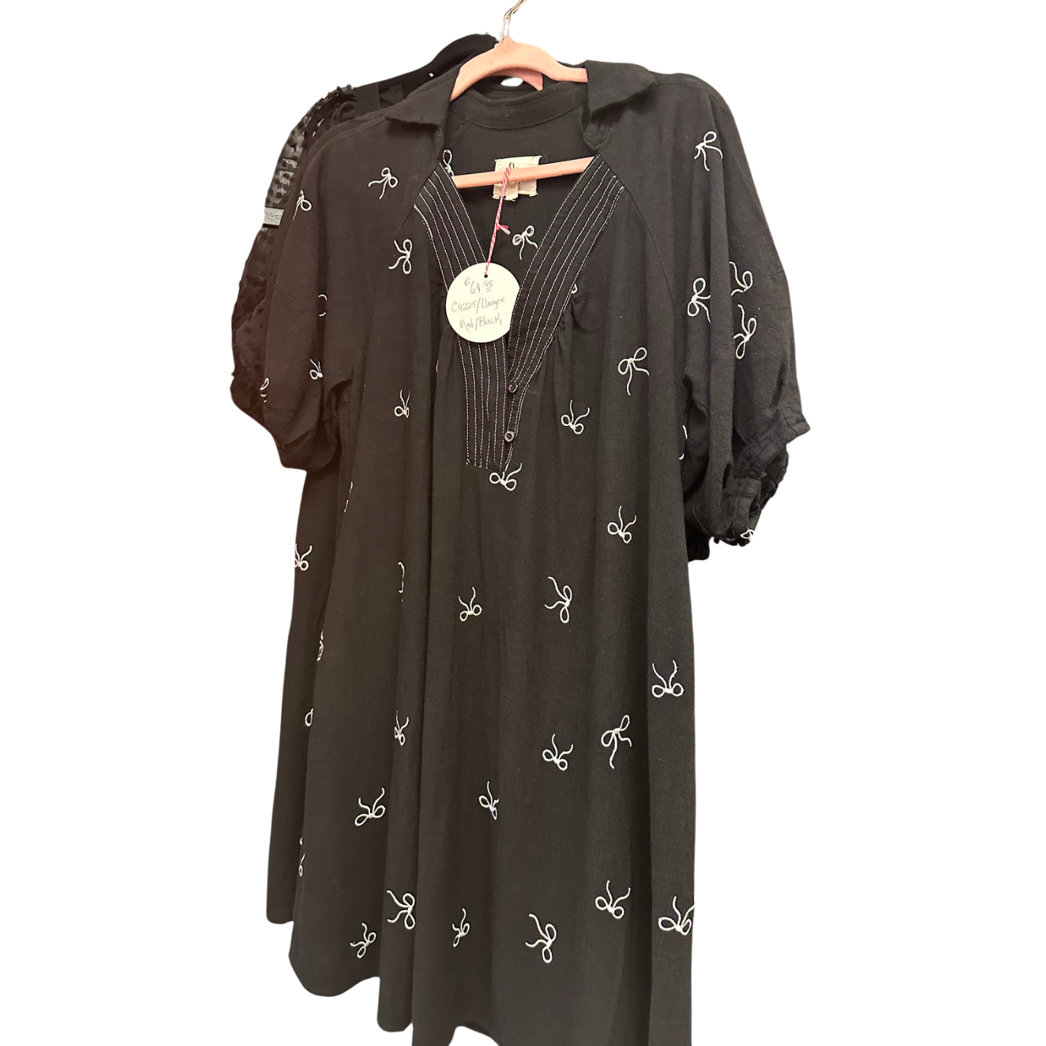 Umgee Black Ribbon Print Flowy Dress on a rack in Merle Norman Elizabethton. 