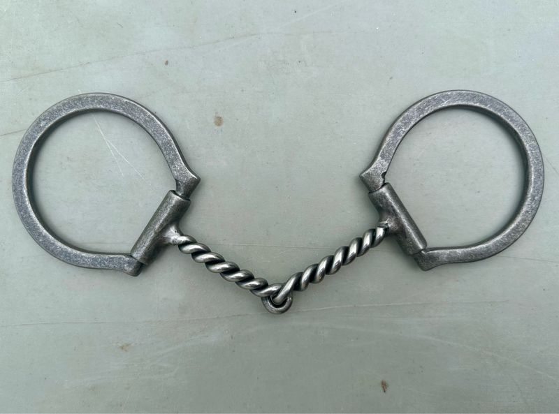 Dee Ring Snaffle Bit with 3 1/2” Sleeved Dee Rings and 5 1/8” Twisted Mouth Piece in Gun Metal Gray Brushed Steel