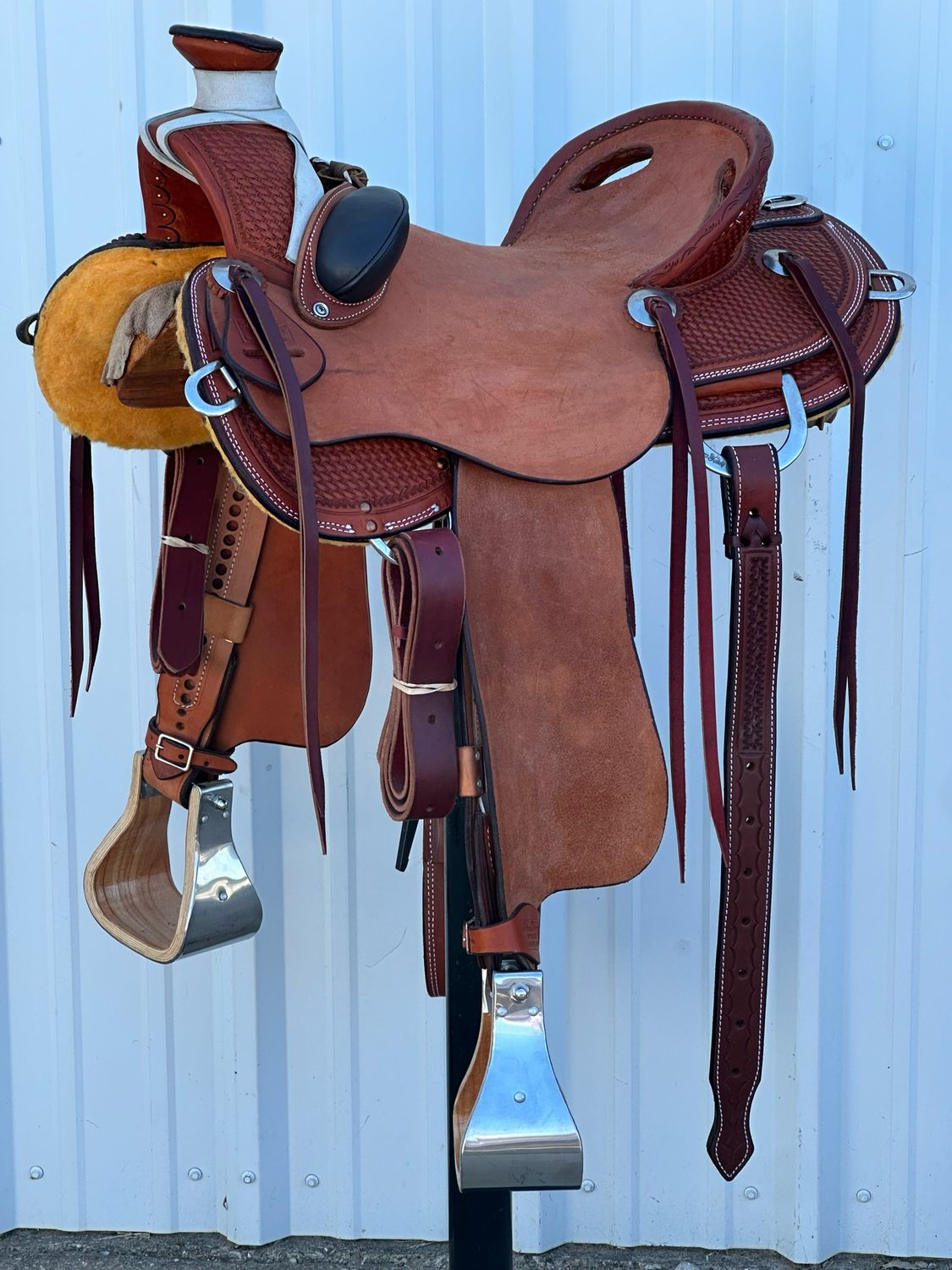 Robert Teskey Mule Saddle with a 16- inch Rough Out Seat Tooled Basket Weave with Bucking Rolls Chestnut Finish