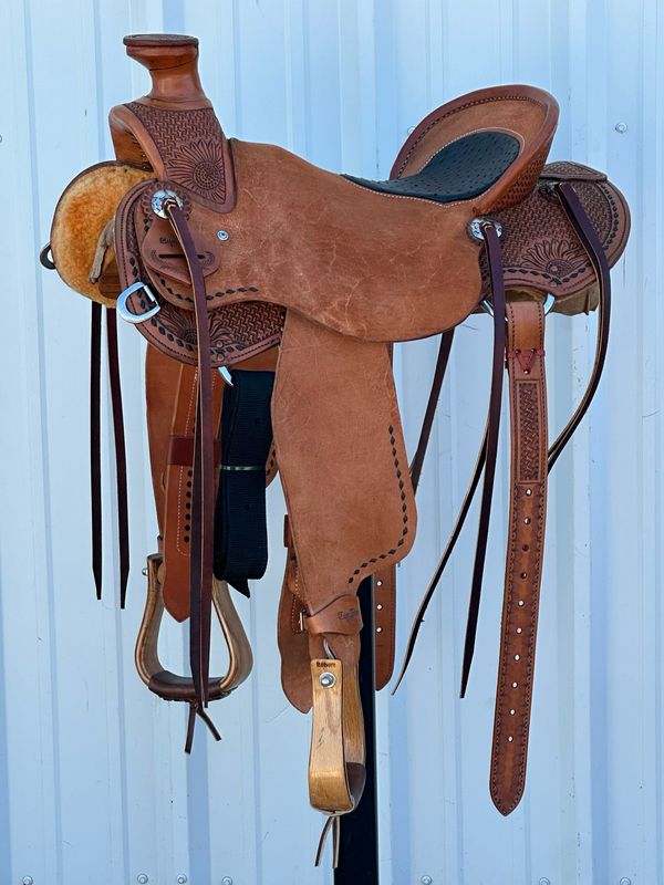 Robert Teskey Elite Lady Wade Saddle with a 16 3/4- inch Ostrich Inlay Seat Tooled Hourglass Waffle with Sunflower and Black Buck Stitch Border