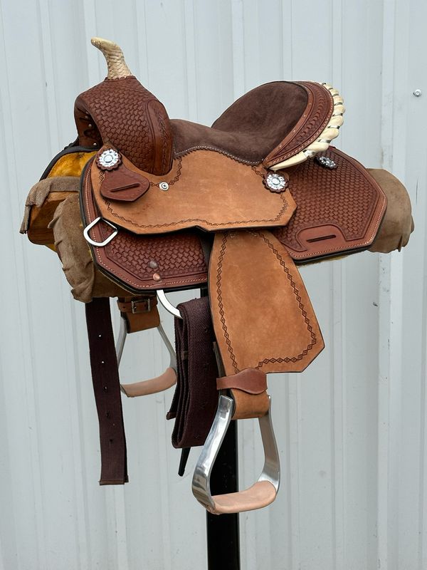 Chisom Trail Kid’s Saddle with a 10- inch Padded Brown Suede Seat Tooled Interlace with Diamond Border and Berry Conchos