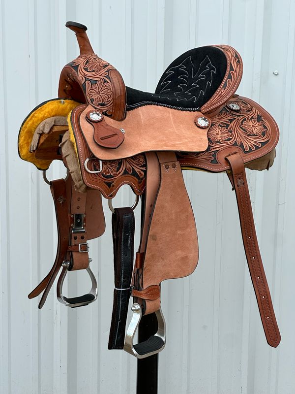 Chisom Trail Kid’s Saddle with a 12 1/2- inch padded Black Suede Seat Tooled Floral with Berry Conchos
