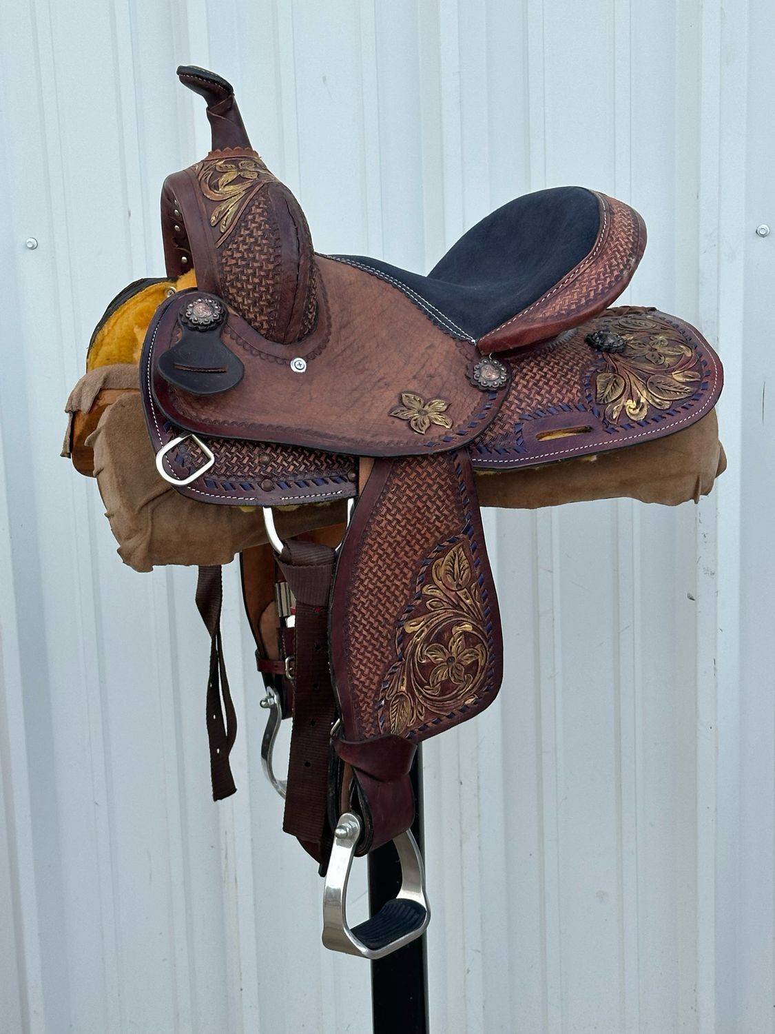 Chisom Trail Kid’s Saddle with a 11 1/2- inch Padded Black Suede Seat Tooled Basket Weave with Floral snd Buck Stitch Border
