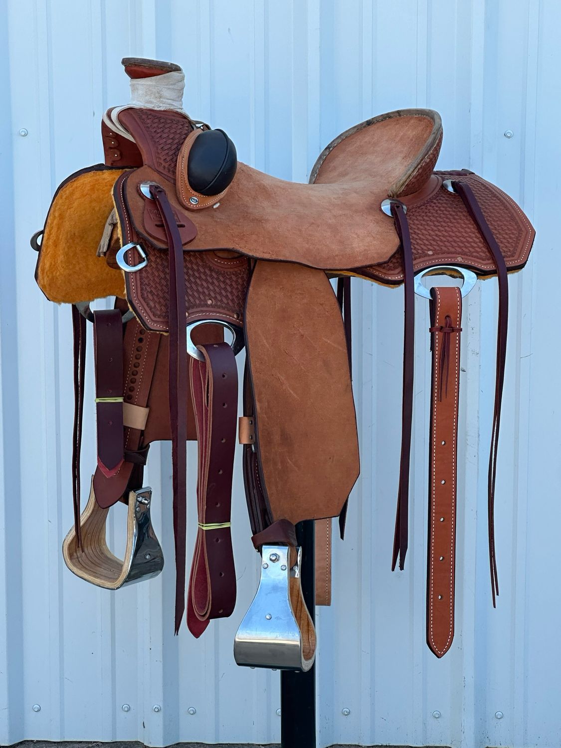 Robert Teskey Cliff Wade Ranch Roping Saddle with a 16- inch Rough Out Seat Tooled Basket Weave Bucking Rolls Medium Finish