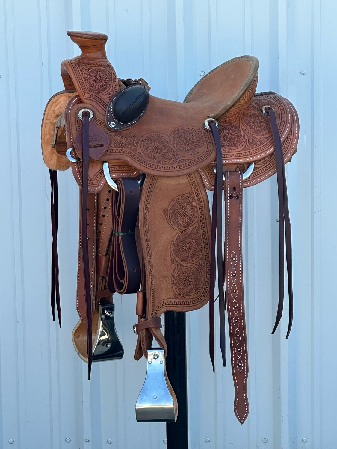 Robert Teskey Cliff Wade Ranch Roping Saddle with a 15- inch Rough Out Seat Tooled Sunflower with Snake Border Bucking Rolls Medium Finish