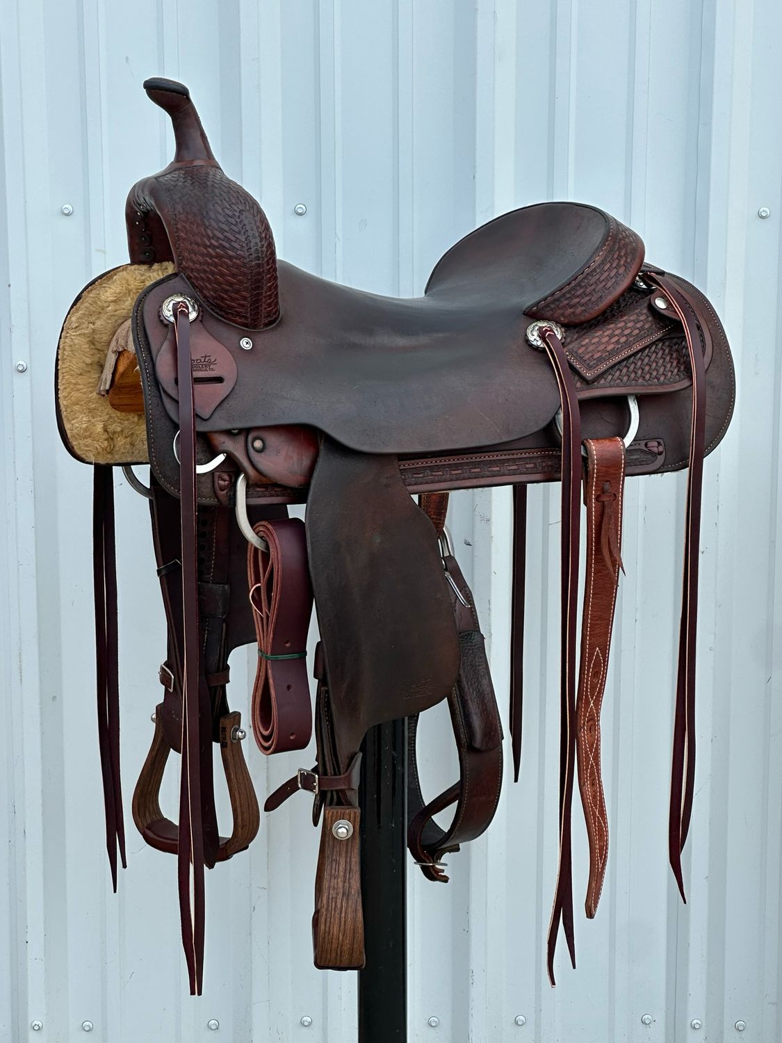 Coats Cutting Horse Saddle with a 17- inch Slick Out Seat Tooled Basket Weave Dark Finish