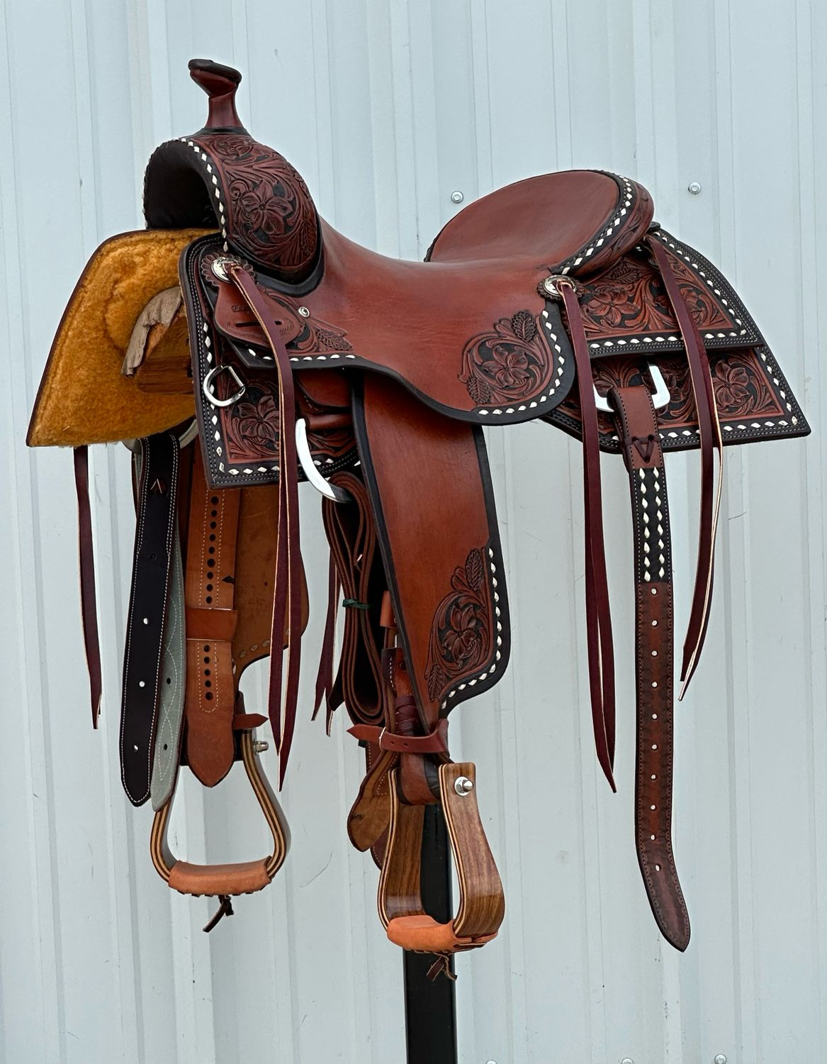 Robert Teskey Elite Ranch Cutting Saddle with a 16- inch Slick Out Seat Tooled Floral with Dark White Buck Stitch Border