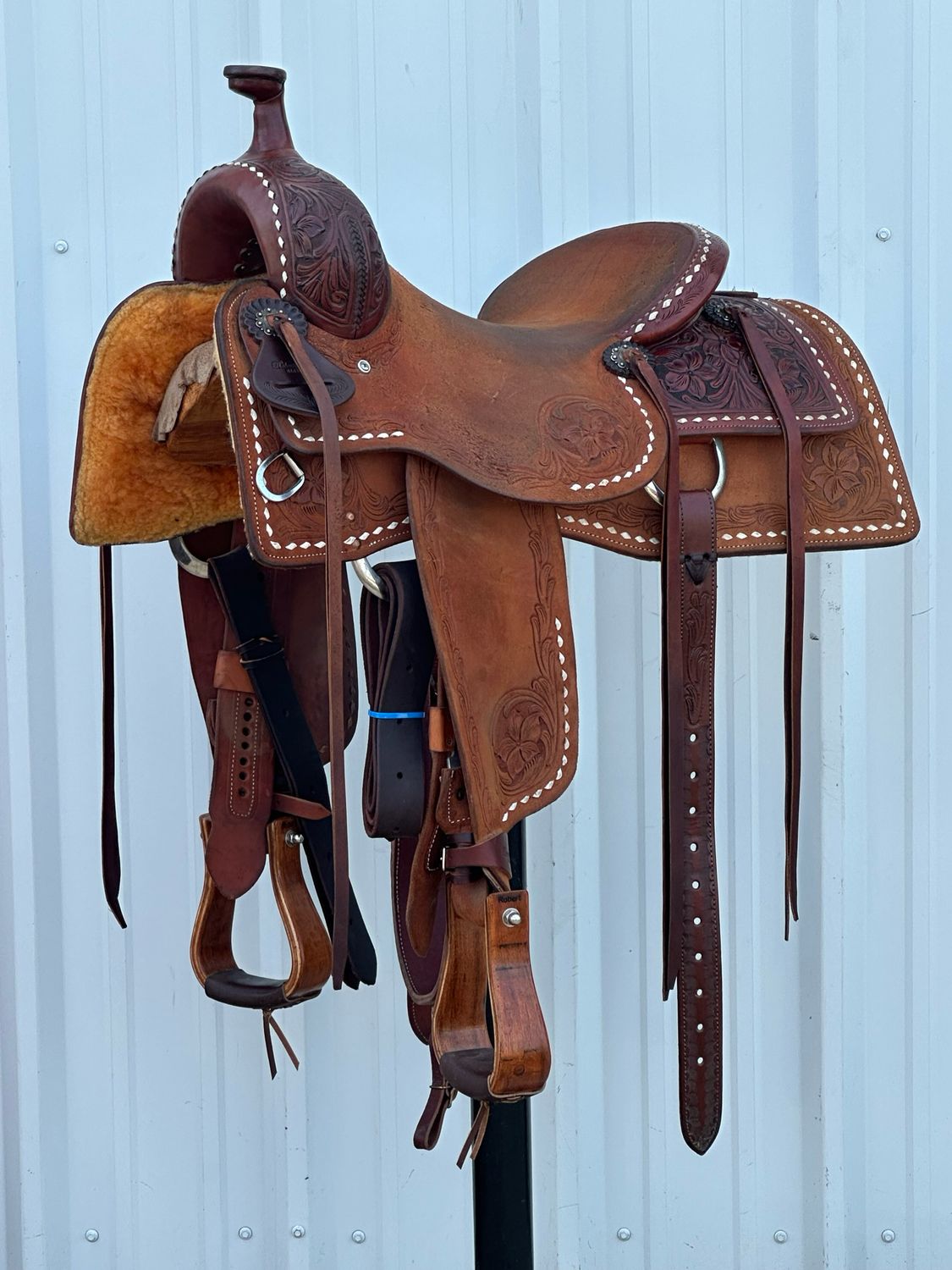 Robert Teskey Elite Ranch Cutting Saddle with a 15 1/2- inch Rough Out Seat Tooled Floral with Buck Stitch Border Medium Finish