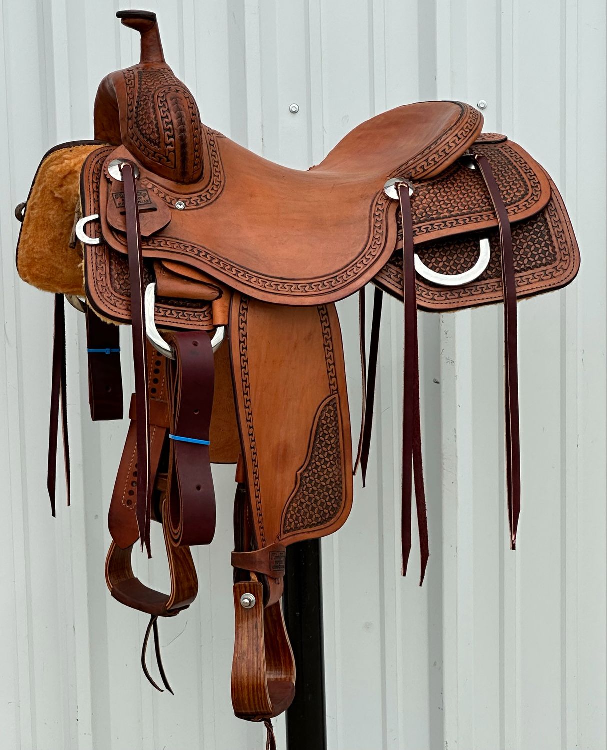 Robert Teskey Ranch Cutting Saddle with a 16- inch Slick Out Seat Tooled Interlace with Snake Border Antiqued Medium Finish Comes with Back Flank