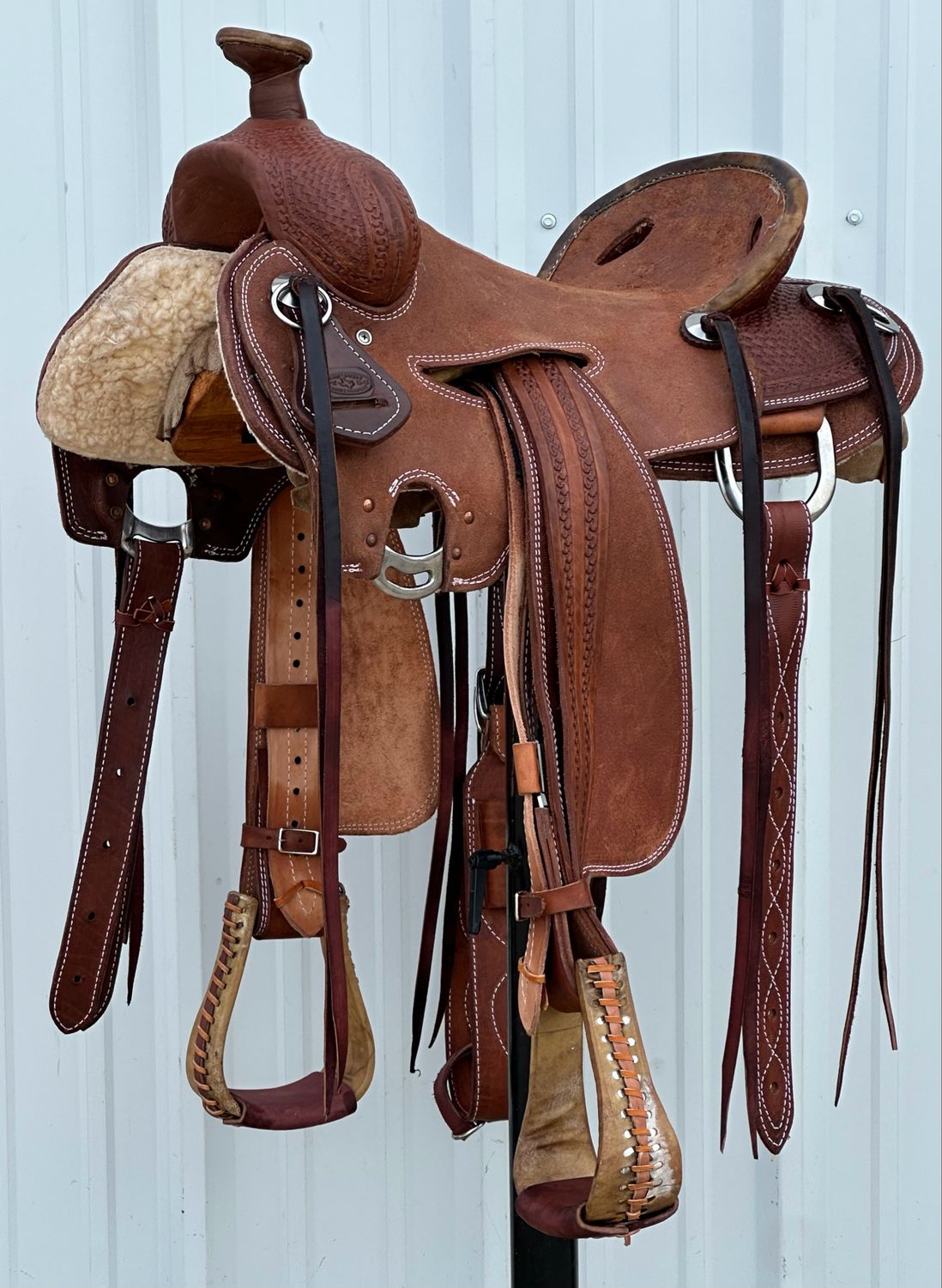 Heart O Texas Mule Saddle with a 16- inch Rough Out Seat Tooled Basket Weave with Snake Border Dark Finish