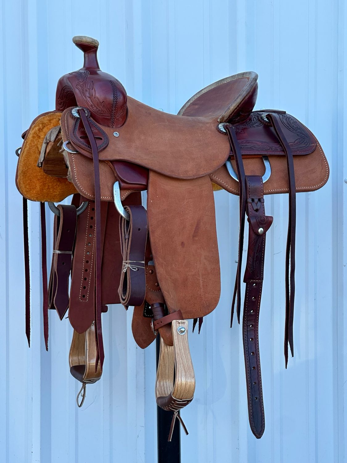 Robert Teskey Elite Ranch Roping Saddle with a 15- inch Highback Rough Out Seat Tooled with a Feather Border Dark Finish
