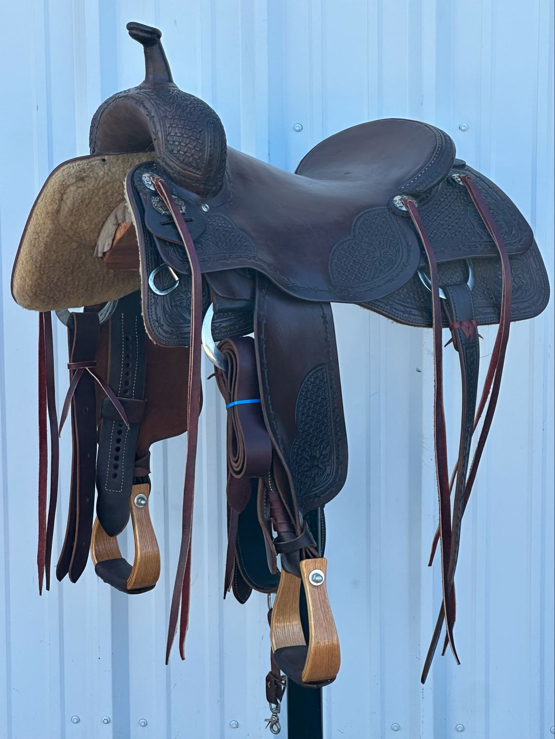 Robert Teskey Elite Cutting Horse Saddle with a 17- inch Slick Out Seat Tooled Floral Interlace with Floral Accent and Barbwire Border Dark Finish