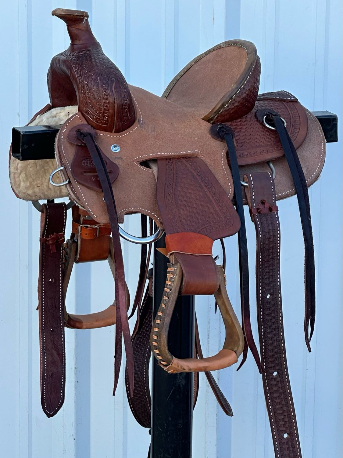 Heart O Texas Kid’s Buckaroo Saddle with a 10- inch Tough Out Seat Tooled Basket Weave with Snake Border Dark Finish