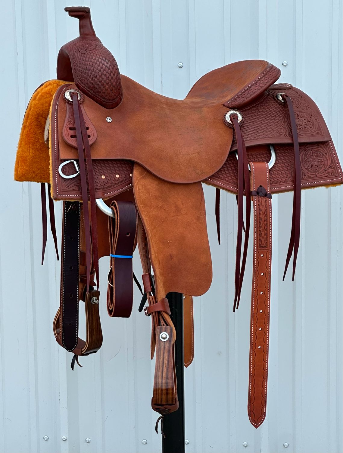 Robert Teskey Elite Cow Horse Saddle with a 16- inch Rough Out Seat Tooled Basket Weave with Floral Accent Medium Finish