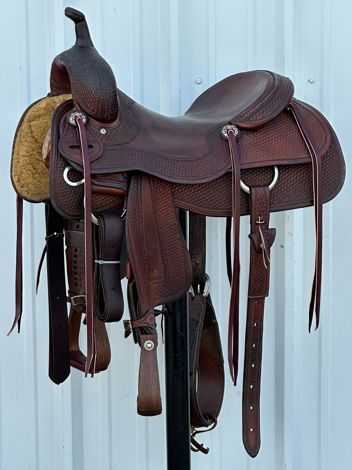 Sean Ryon Fort Worth Tx Leon Harrel Cutting Horse Saddle with a 16 1/2- inch Slick Out Seat Tooled Basket Weave with Double Floral Border Dark Finish