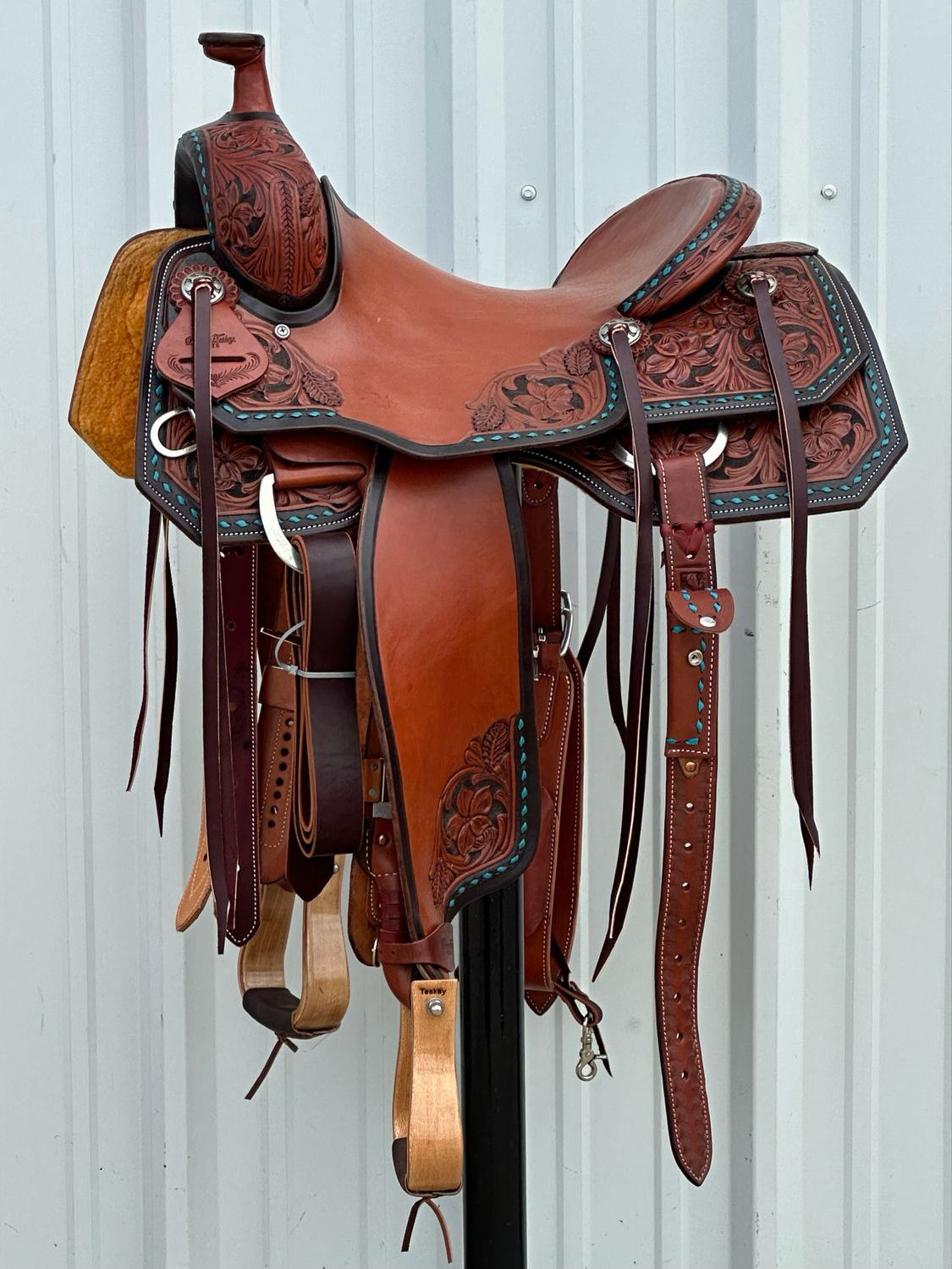 Robert Teskey Elite Ranch Cutting Saddle with a 15 1/4- inch Slick Out Seat Tooled Floral with Turquoise Buck Stitch Border and Painted Edge