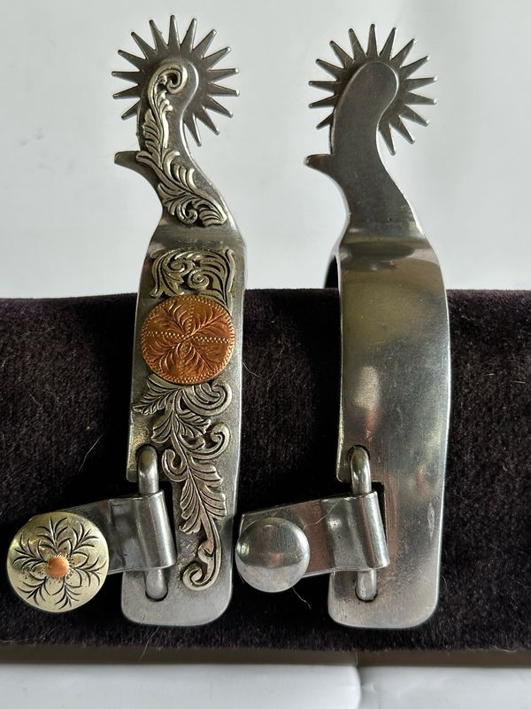 Ladies Western Spurs 1- inch Width Stainless Steel Band with “GS Foliage &amp; Copper Coin” Trim and 2- inch Length Curved Shanks with GS Trim and 18- Point Shark Tooth Rowels