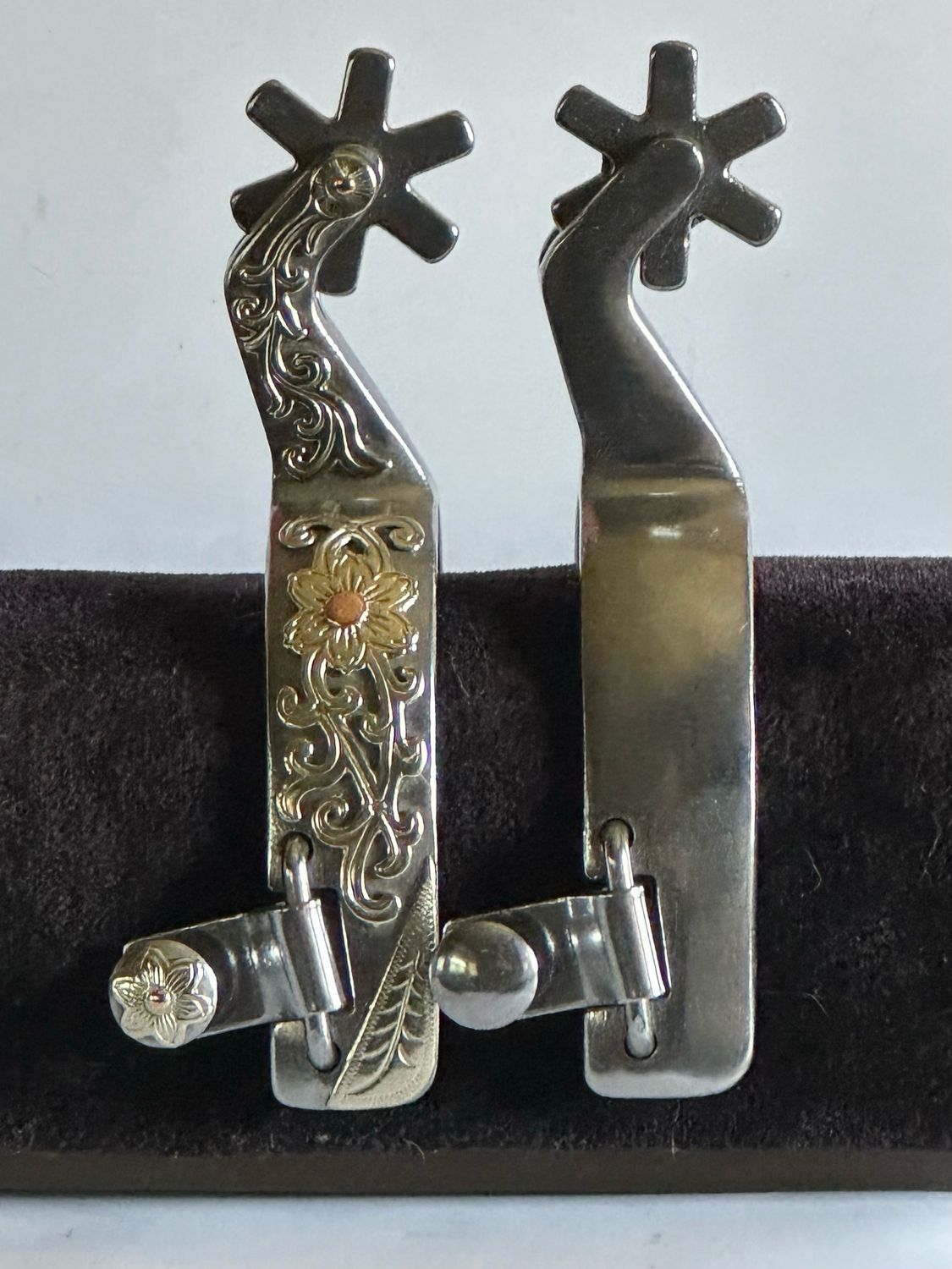 Ladies Western Spurs 1- inch Width Polished Steel Band with Floral GS Trim and Bars and 2- inch Length Angled Shanks with 6- Point Rounded Smooth Rowels