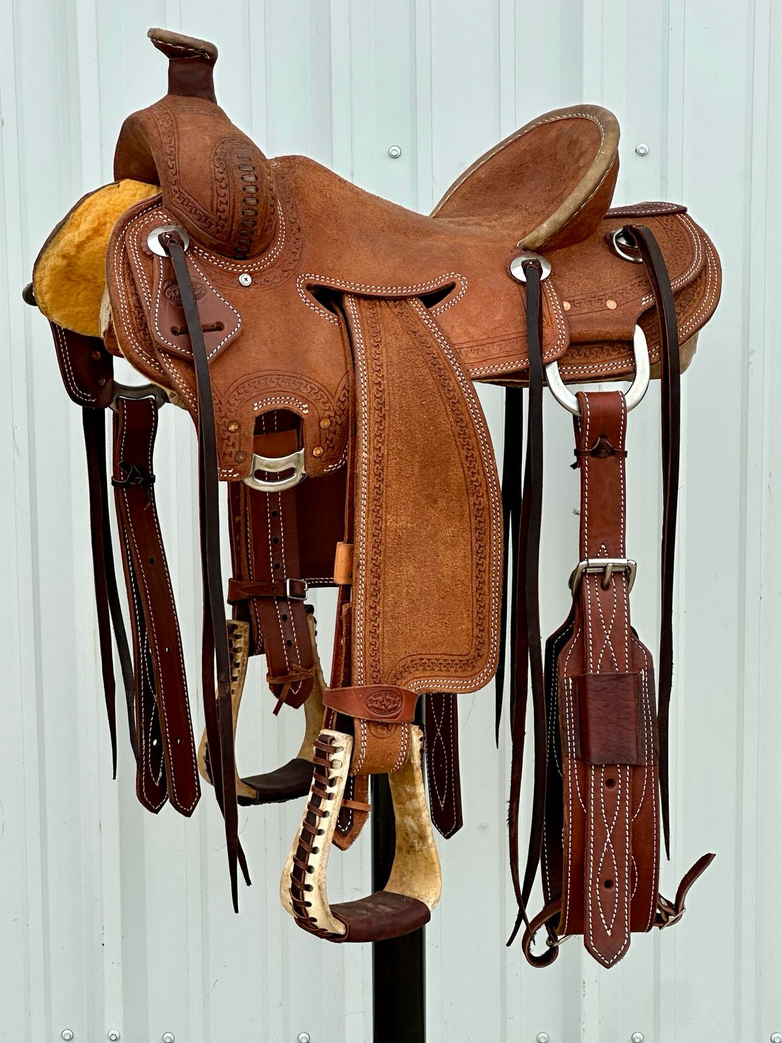 Heart O Texas Ranch Roping Saddle with a 15 1/2- inch Rough Out Seat Tooled with Snake Border Medium Dark Finish