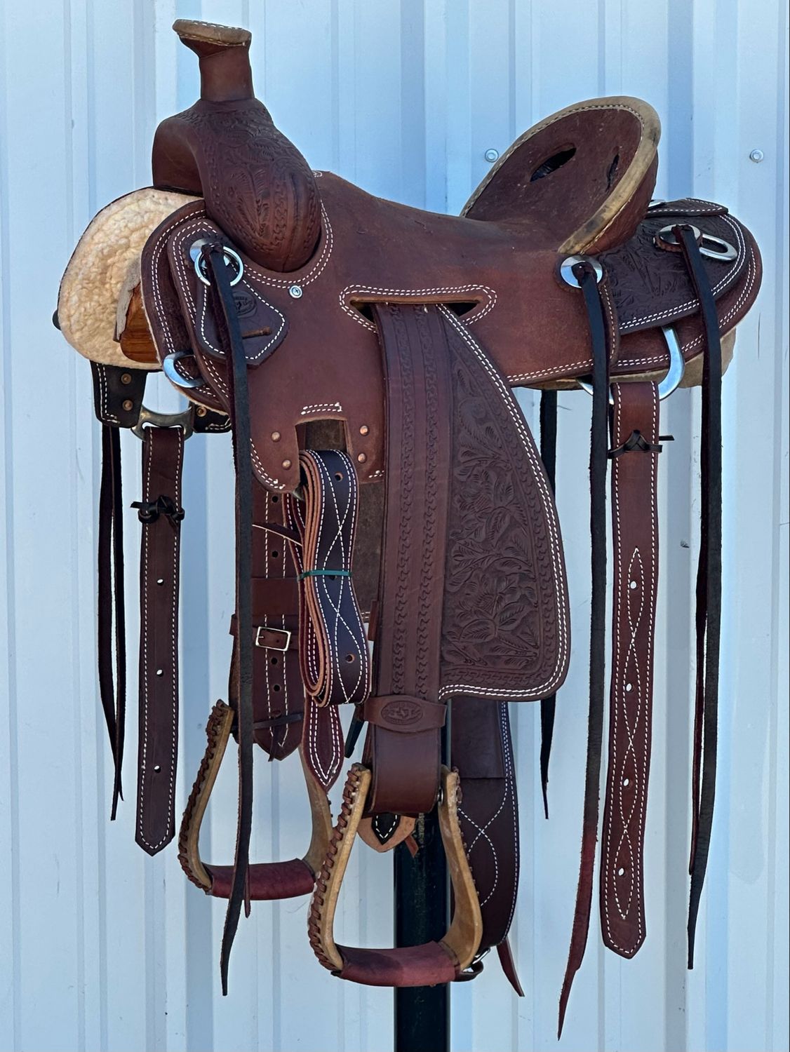 Heart O Texas Mule Saddle with a 15- inch Rough Out Seat Tooled Floral with Snake Border Double Stitch Dark Finish