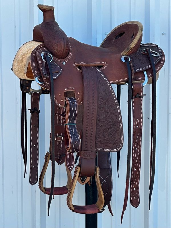 Heart O Texas Mule Saddle with a 15- inch Rough Out Seat Tooled Floral with Snake Border Double Stitch Dark Finish