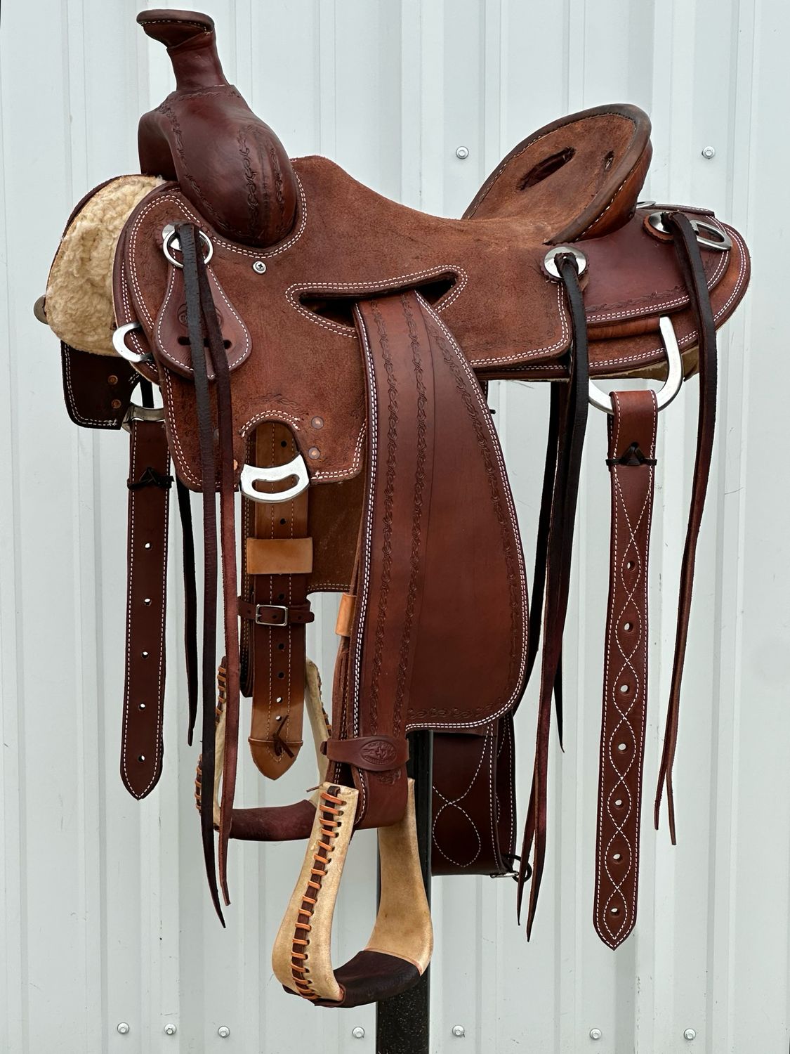Heart O Texas Mule Saddle with a 16- inch Rough Out Seat Tooled with Barbwire Border Double Stitch Dark Finish