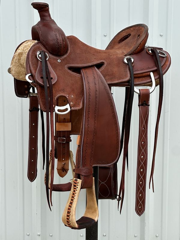 Heart O Texas Mule Saddle with a 16- inch Rough Out Seat Tooled with Barbwire Border Double Stitch Dark Finish