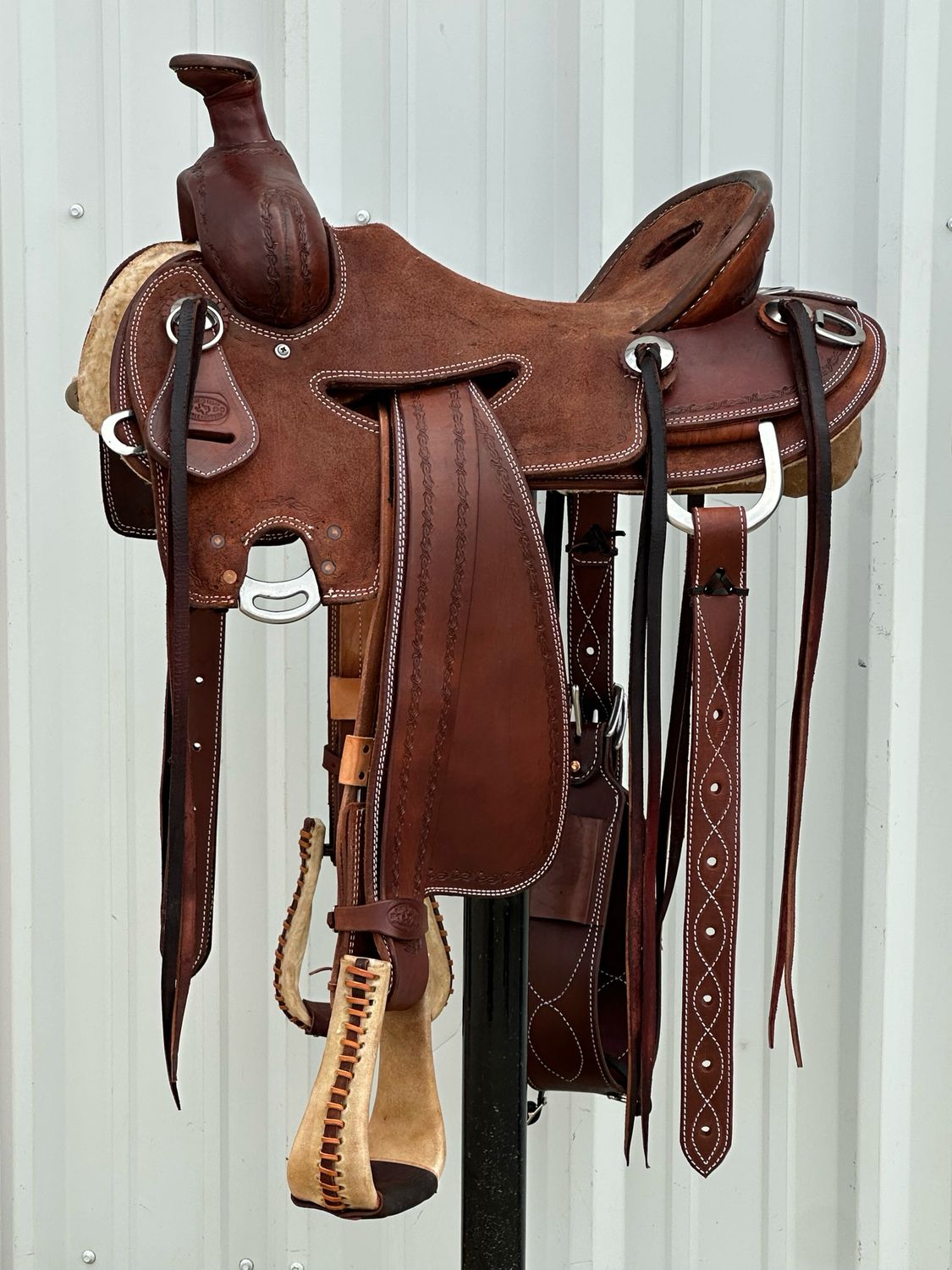 Heart O Texas Mule Saddle with a 16- inch Rough Out Seat All Rougb Out Tooled Barbwire Border Double Stitch Dark Finish