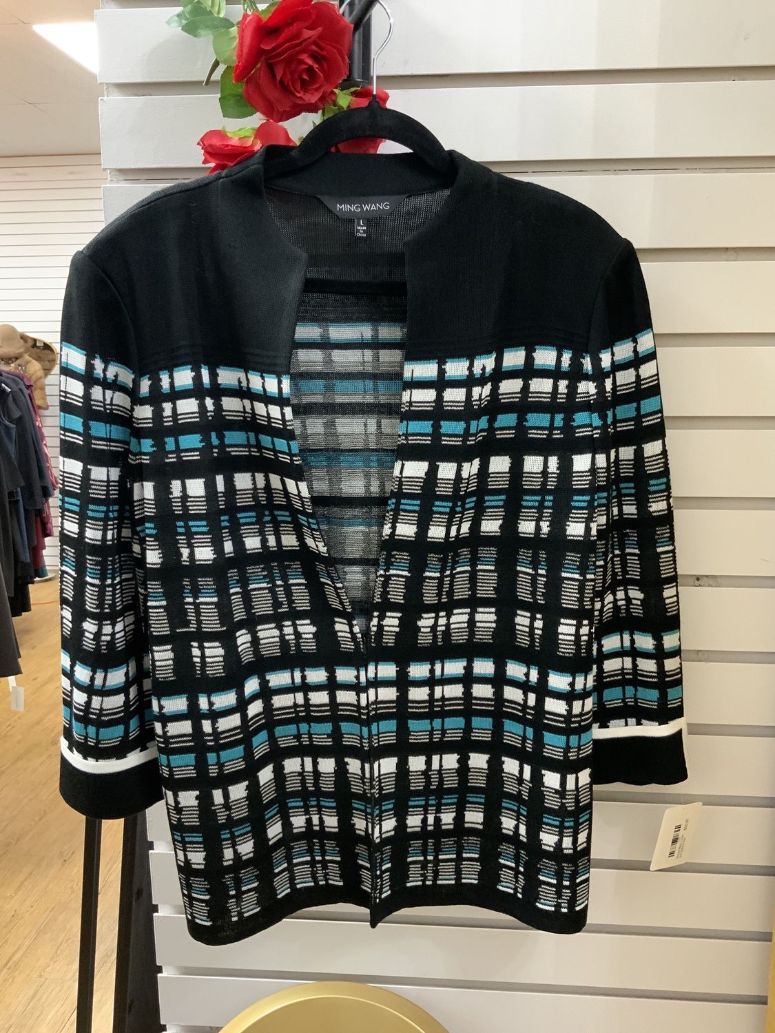 Woman Black, Cream, and Teal Knit Size Large