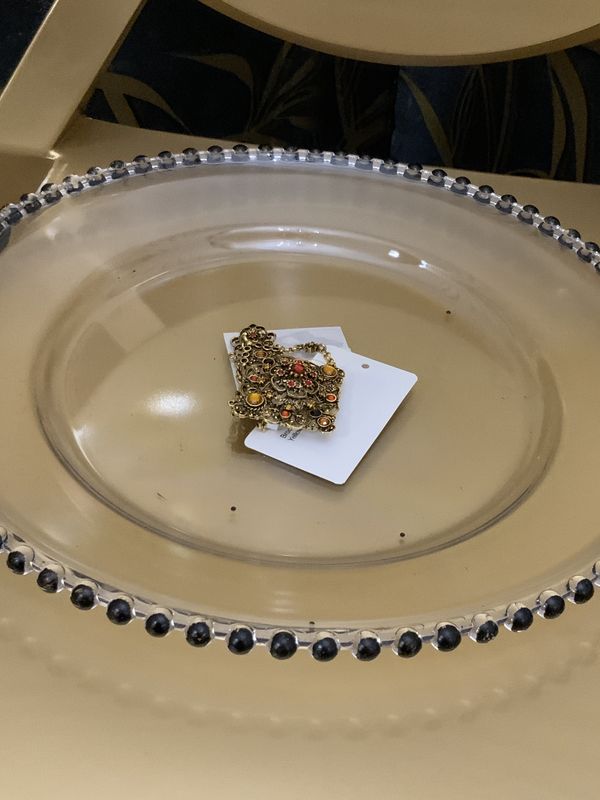 Woman Gold Tone chatelaine style Brooch featuring Red Orange, and Yellow Stone