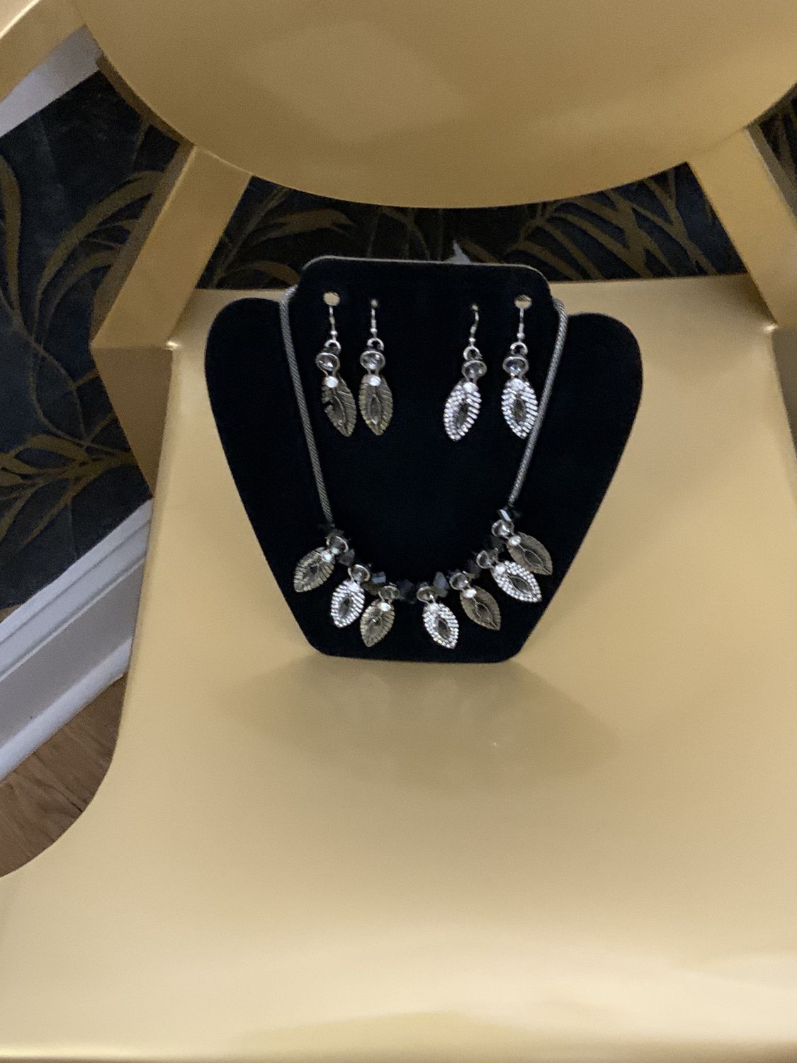 Woman 3 Pcs. Set Silver Tone with Leaf Detail with Clear Stones and Smoke Gray Stones Necklace and Two Pair of Earrings