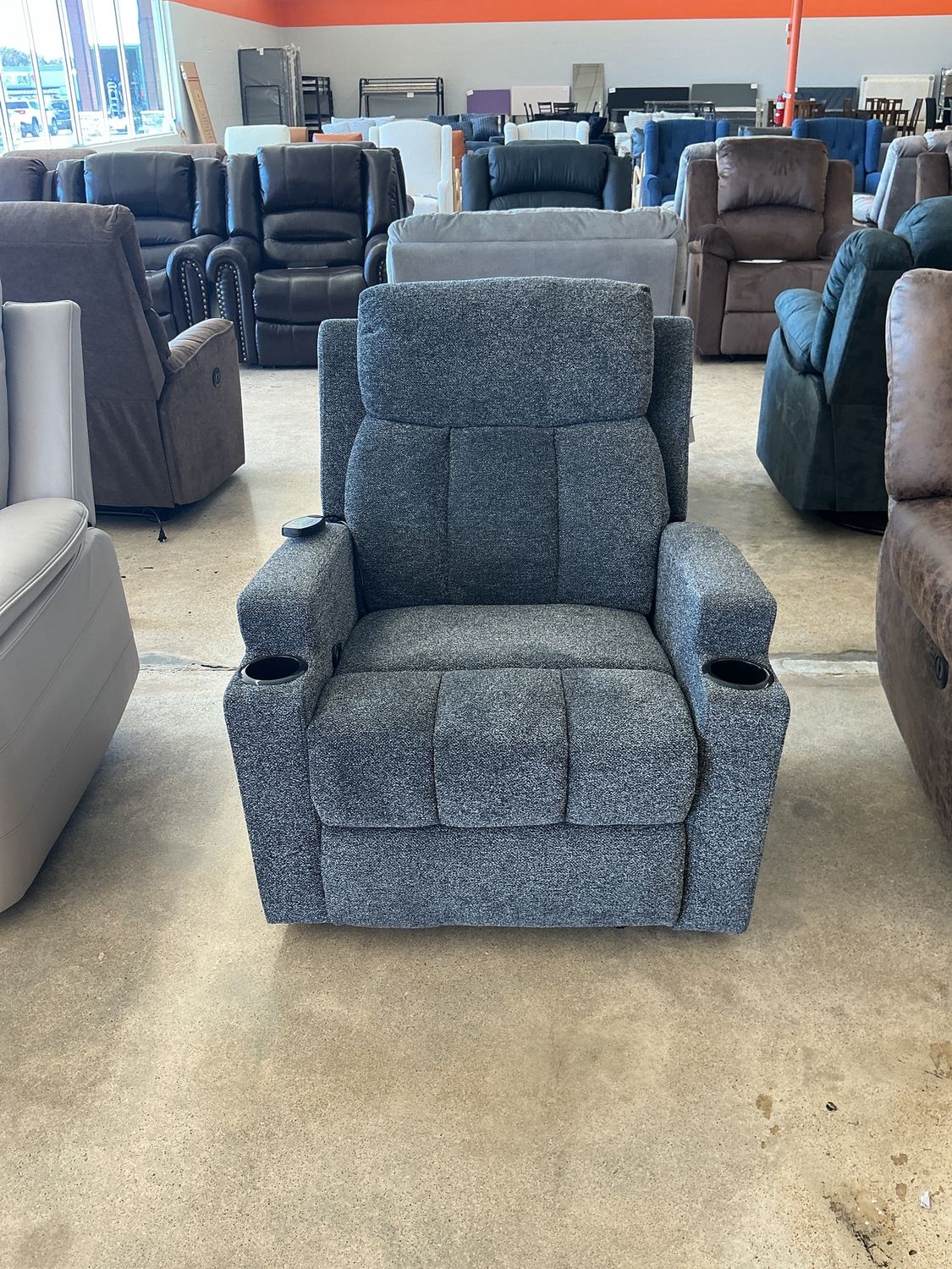 Gray fabric manual recliner with remote control massage and dual cup holders