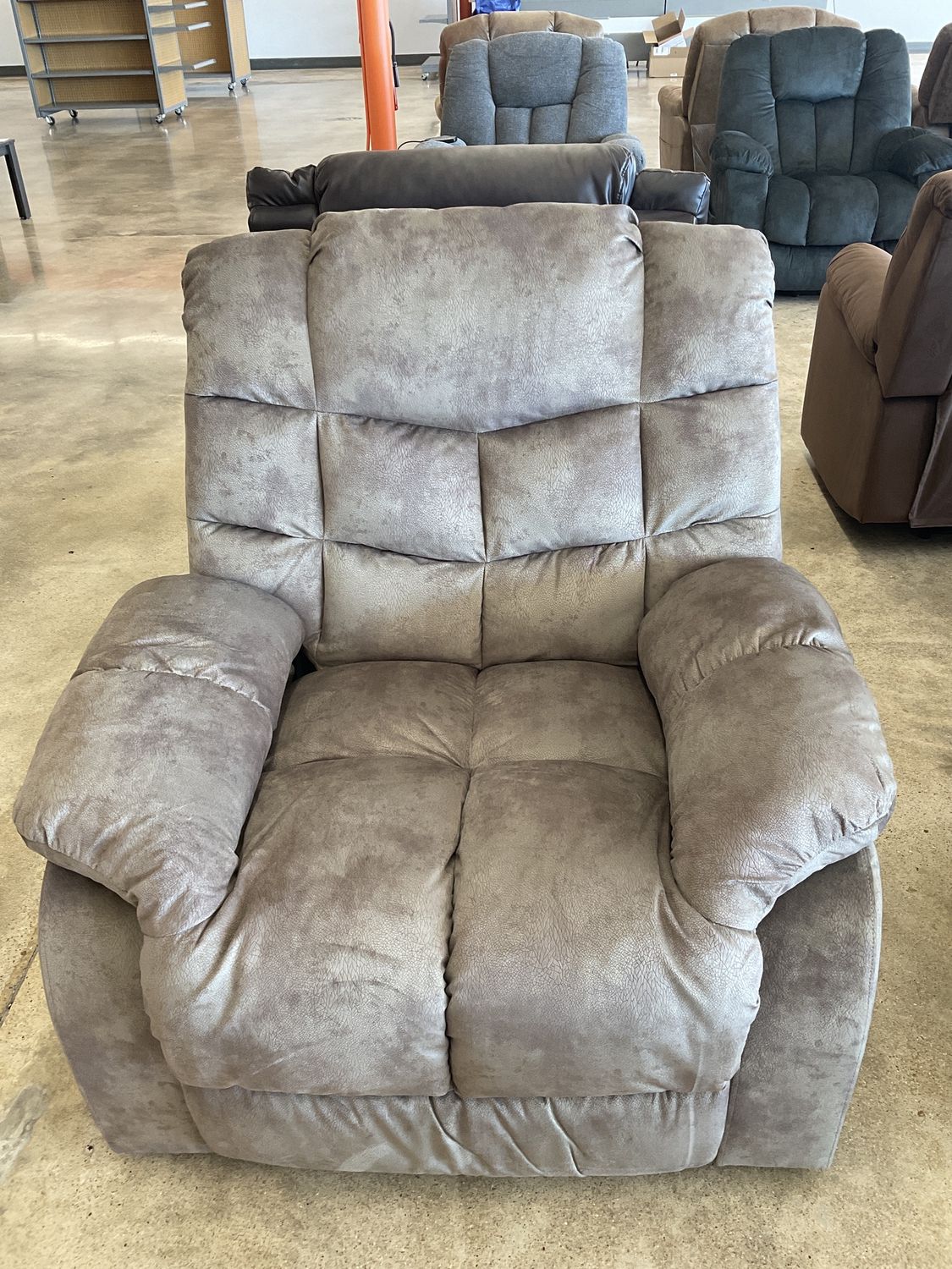 Tan overstuffed recliner