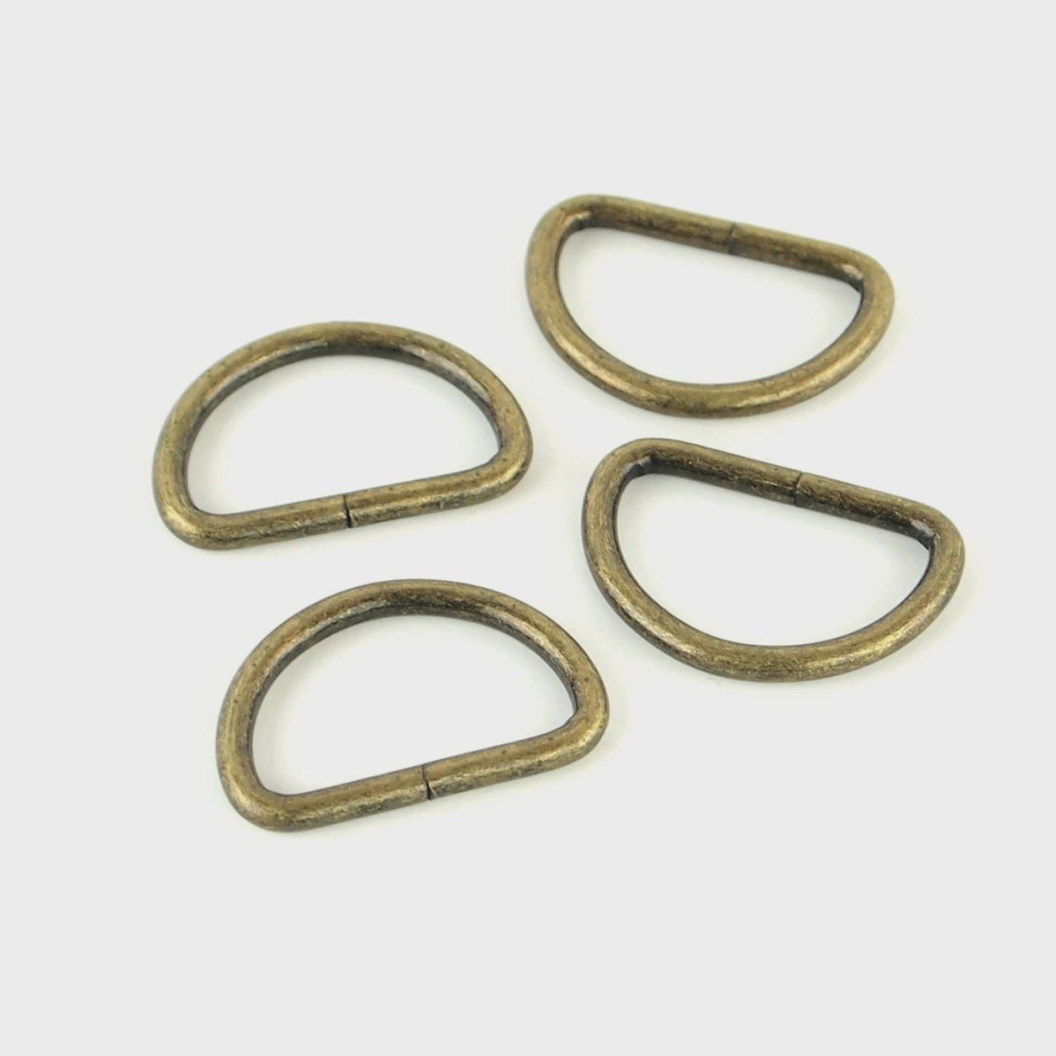 Four D-Rings 1IN Antique