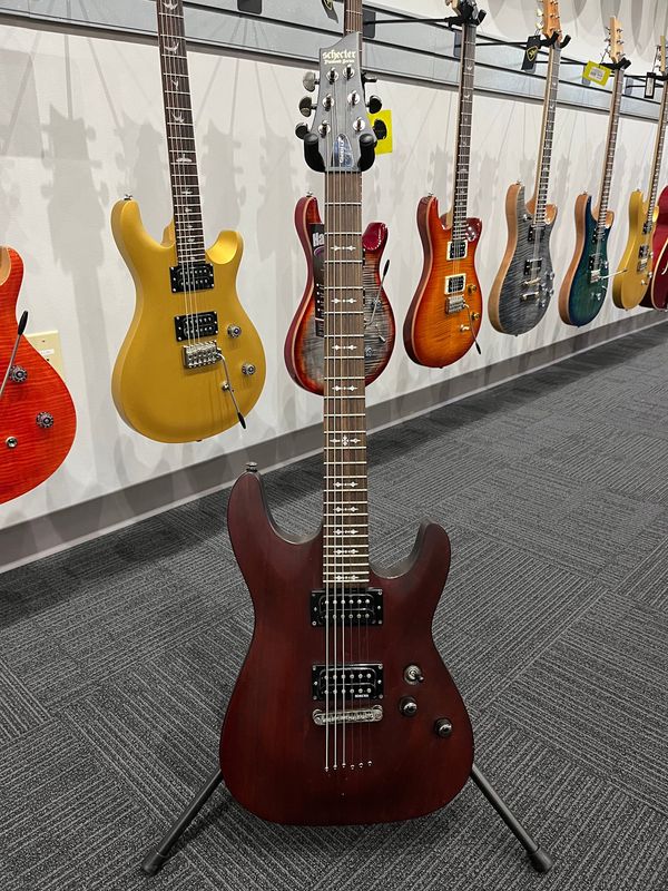 Used Schecter Omen 6 walnut stain