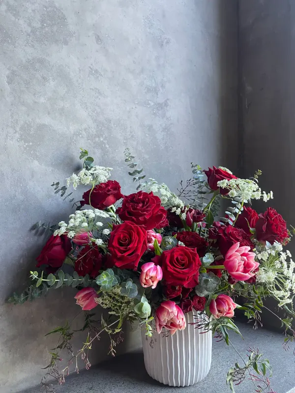 Valentine's Day rose bouquet with pink tulips and eucalyptus in white ceramic vase San Francisco