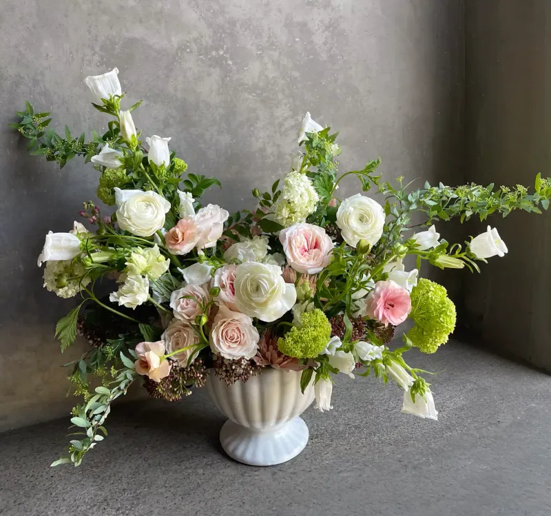 Sweetness arrangement with blush roses, white ranunculus, campanula, and green viburnum Le Bouquet San Francisco