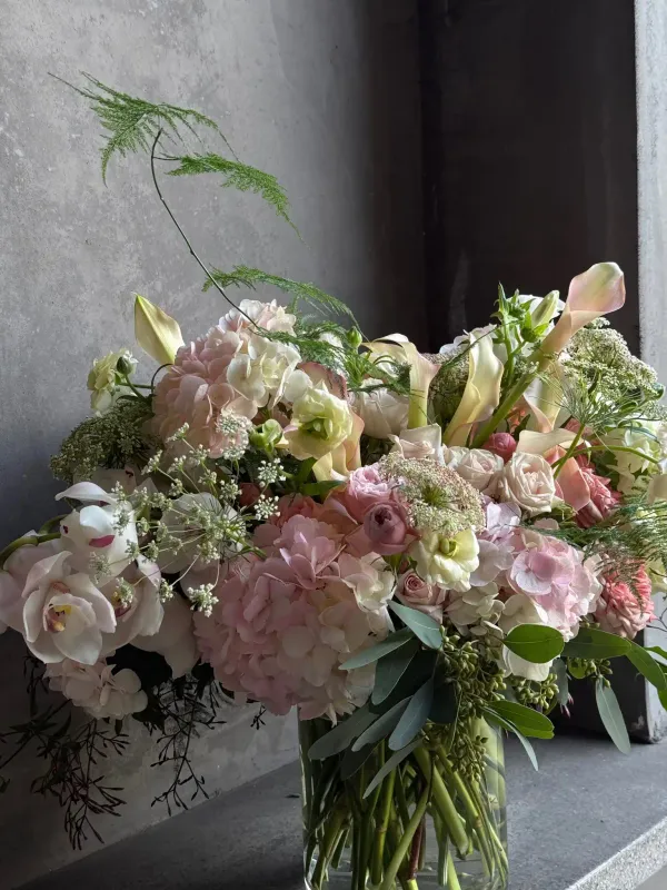 Hydie arrangement with blush hydrangea calla lilies roses and lisianthus San Francisco florist