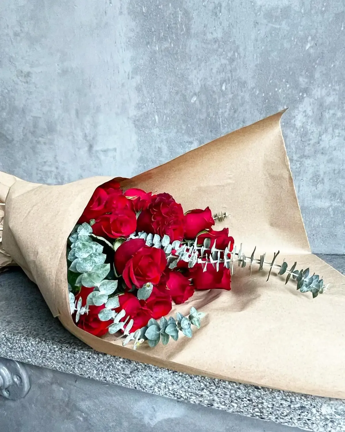 Two Dozen roses with eucalyptus