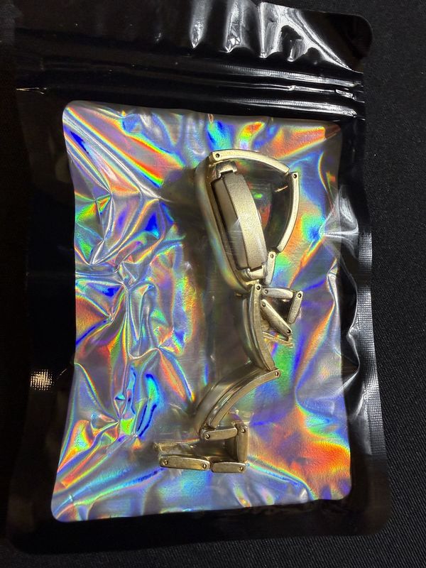 Royalton Gold toned Peek-a-boo slide Watch