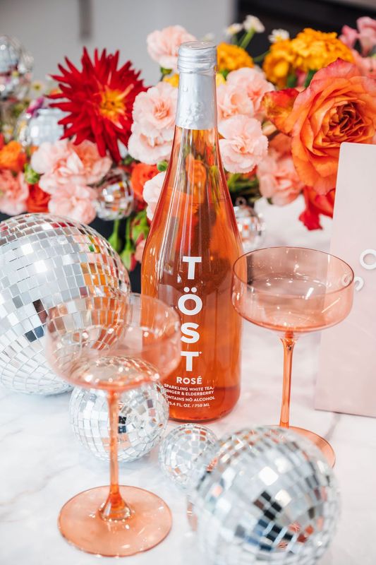 Bottles of Wine Alternatives with Glasses and Disco Balls