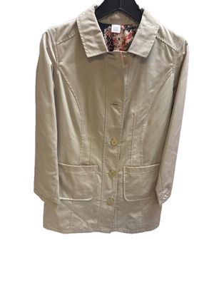 beige women's trench coat with a floral inner lining.