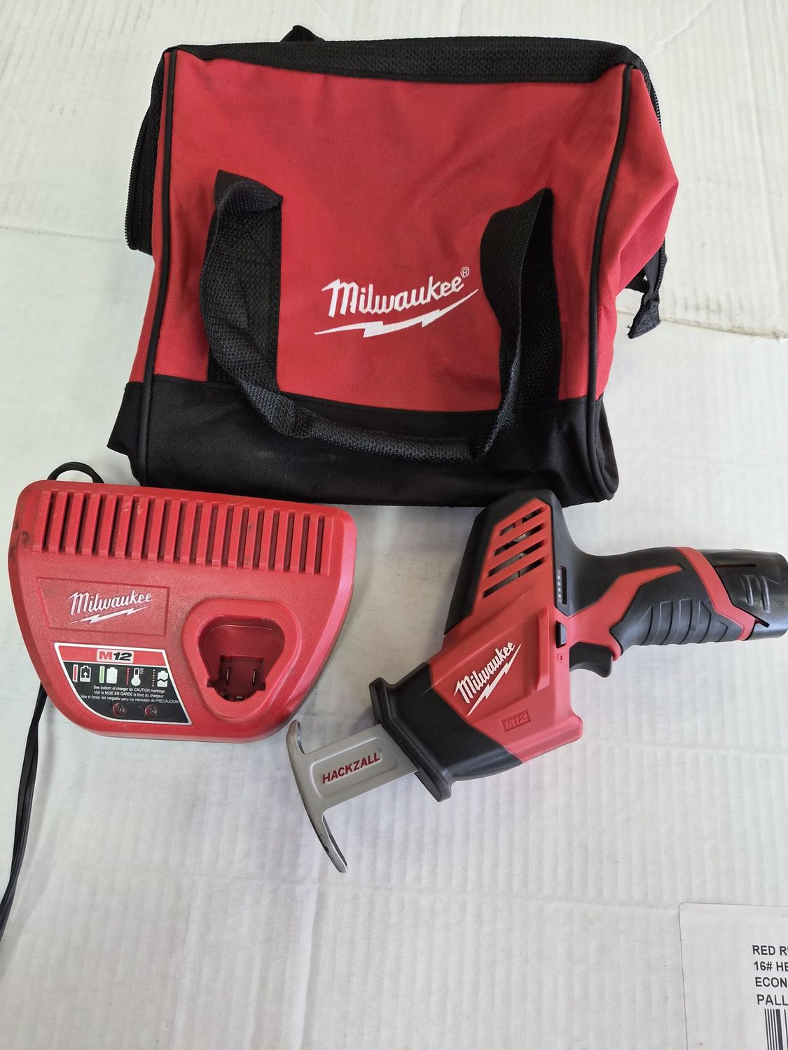 2420-21 Milwaukee M12 12V Lithium-Ion HACKZALL Cordless Reciprocating Saw Kit with One 1.5Ah Battery, Charger and Tool Bag, Condition: Use like new