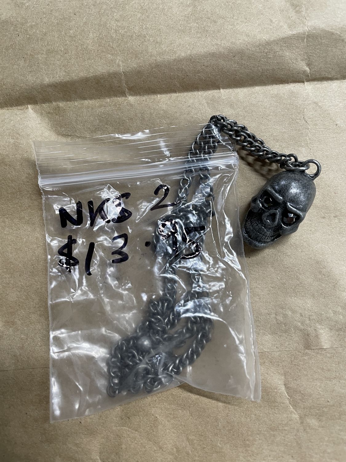 Silver Burnt Skull with Jewels in Eyes Necklace