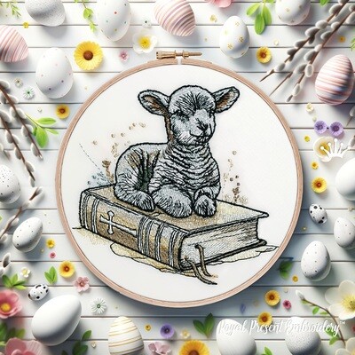 The Lamb of God sits on the Bible Machine embroidery design