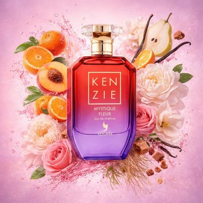 Kenzie Mystique Fleur de Volaré entouré de mandarines, d’oranges, de poires, de pêches, de magnolias, de pivoines, de roses, de vétiver, de vanille et de praliné