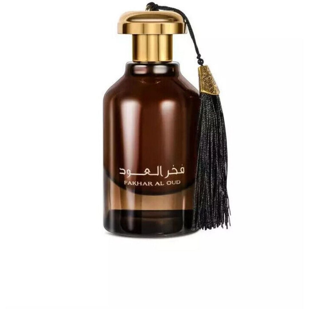 Flacon ambré Fakhar Al Oud d’Ard Al Zaafaran, eau de parfum 100 ml avec pompon noir