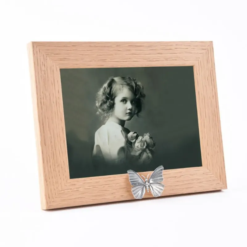 Fotolijst in Eikenhout + rvs vlinder urn